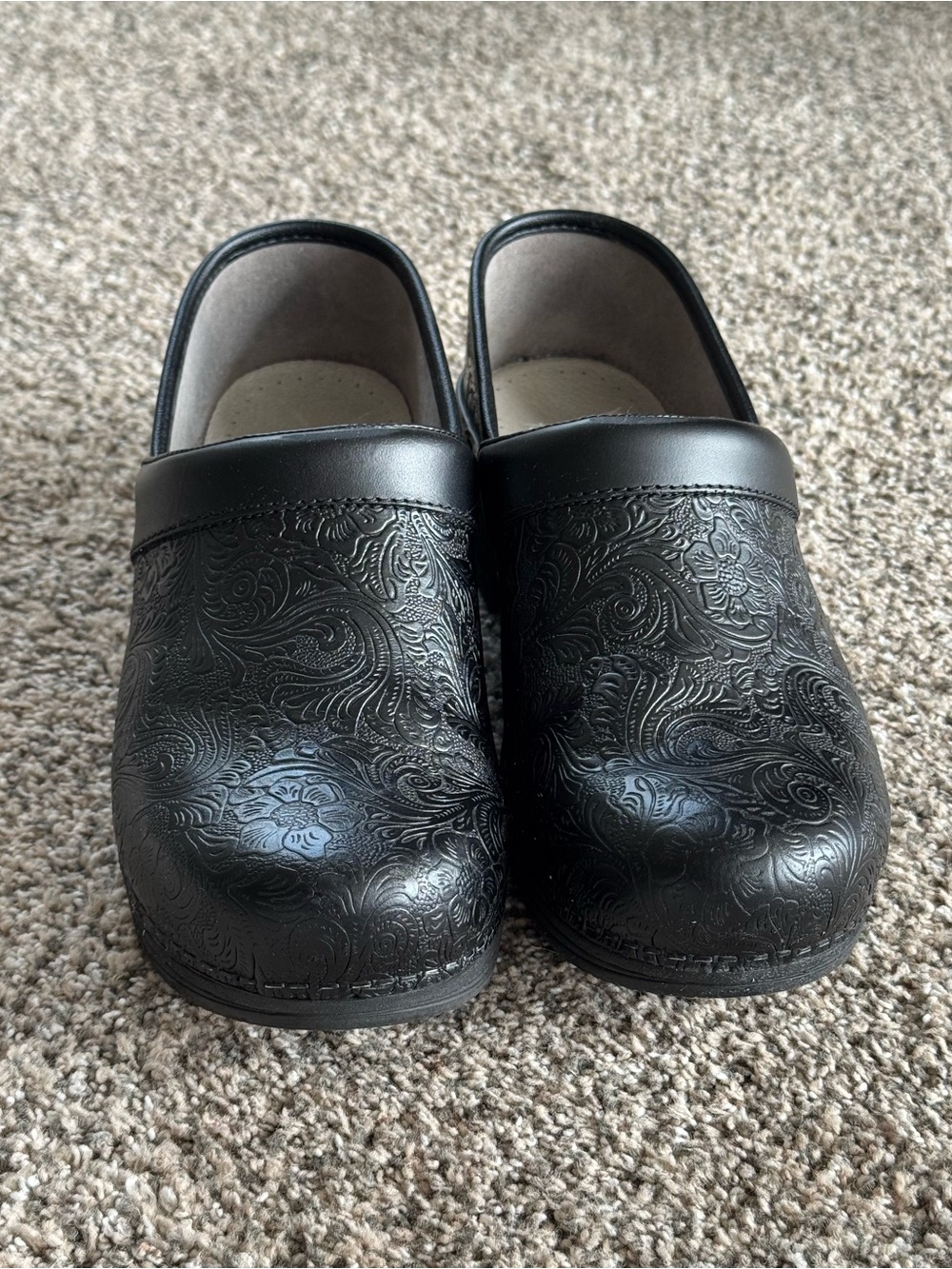 Dansko Professional LT Pro clogs in black floral tooled leather.